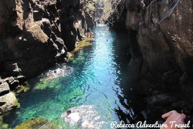 Las Grietas in Galapagos Islands, clear blue water surrounded by its rocks