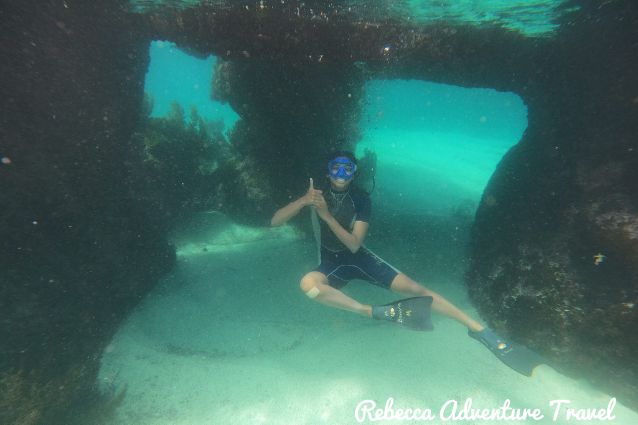 Traveler posing while snorkeling in Galapagos Islands