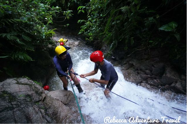 Group of guided tourists in their canyoning adventure